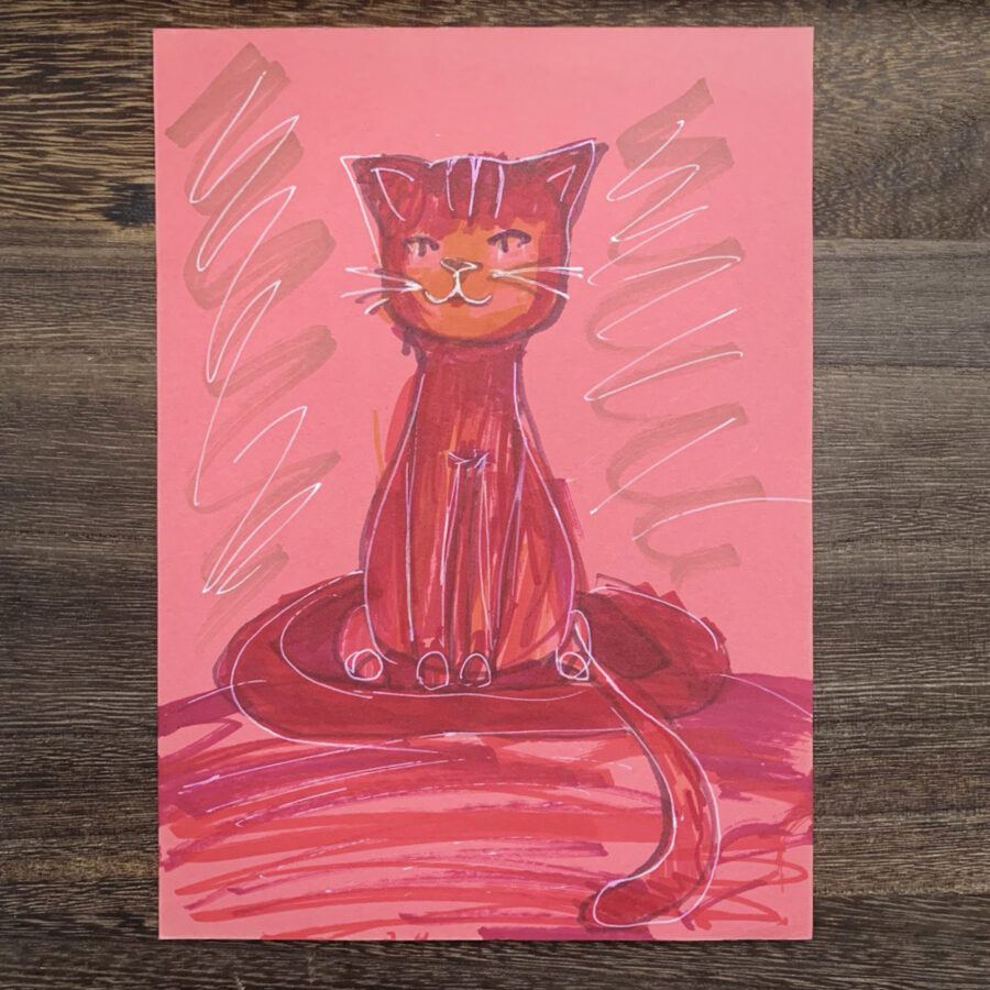 Рисунок на цветной бумаге: котенок